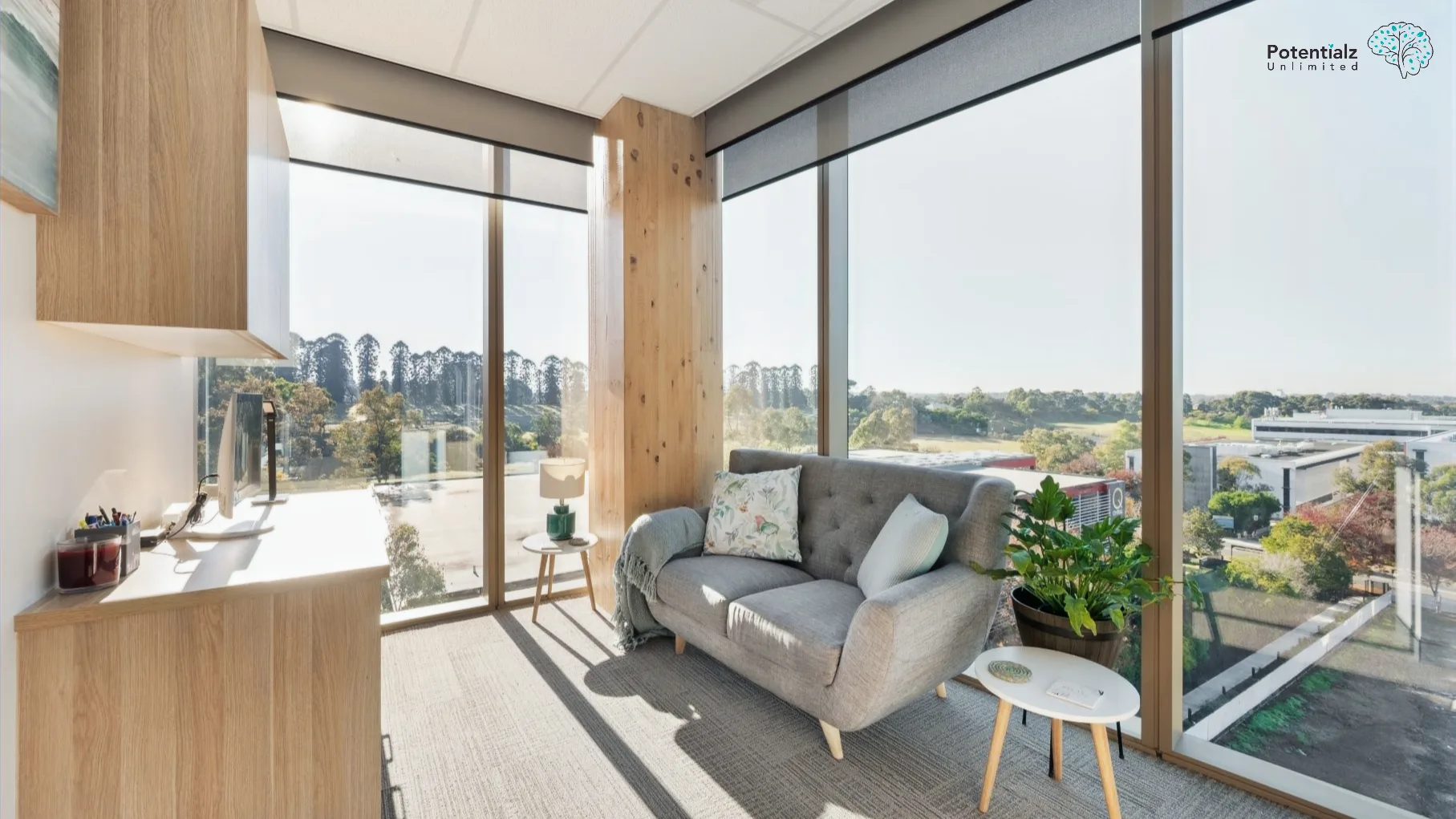 A cozy and inviting room in our practice, featuring warm lighting and comfortable seating, complemented by large windows with a scenic view.