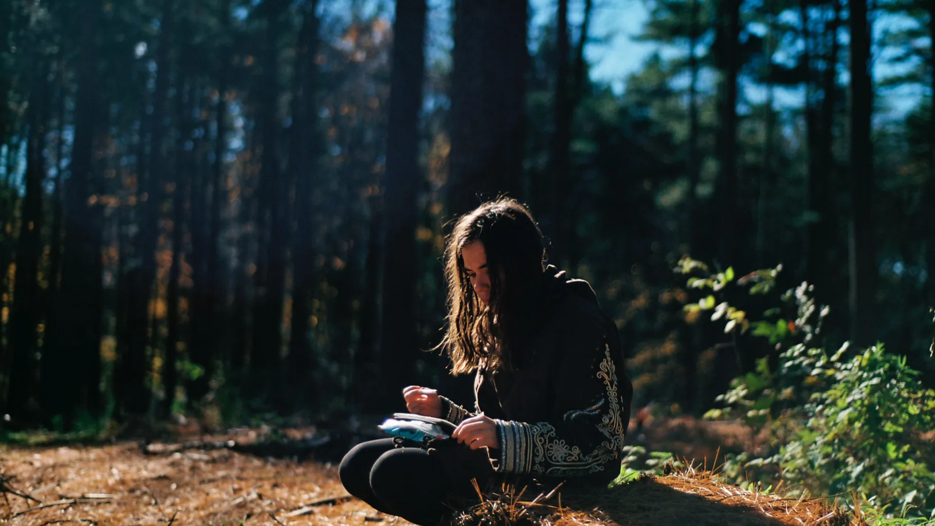 A girl journaling in a peaceful outdoor setting